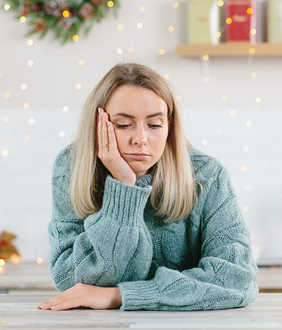 Woman looking for ways to cope with PTSD and holiday stress