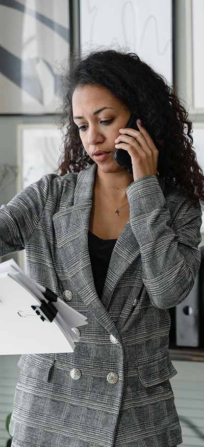 Health insurance out-of-network benefits coverage being discussed on the phone with a woman seeking therapy