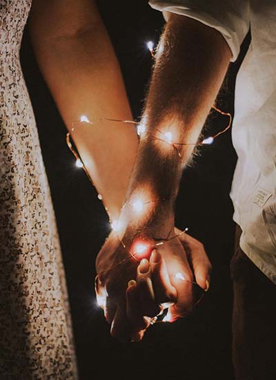 two people holding hands, showing intimacy in their relationship after trauma