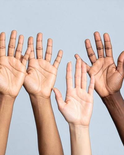 A photo of many hands raised signifying how the term trauma-informed has become a buzzword that doesn't always mean the correct care for PTSD symptoms A photo of many hands raised signifying how the term trauma-informed has become a buzzword that doesn't always mean the correct care for PTSD symptoms