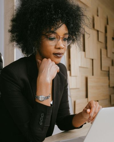 A woman preparing for an online therapy session A woman preparing for an online therapy session