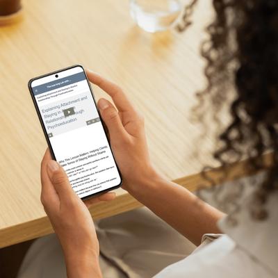 A woman earns her ACE SW CEUs and NBCC CEUs from her phone
