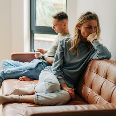 A woman feeling isolated as her partner withholds affection as a form of coercion