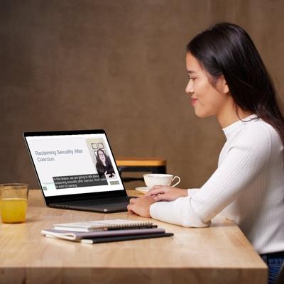 A woman watches a video lesson from When Consent is Compromised - Applied Clinical Skills for Treating Sexual Coercion